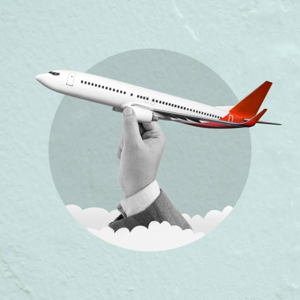 Business hand holding a passenger airplane