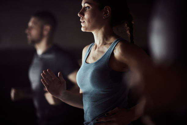 istock Athletic woman warming up in a gym. 2159296756