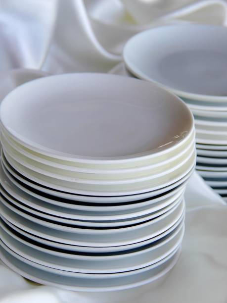 istock a photography of a stack of plates on a white cloth. 2159297007