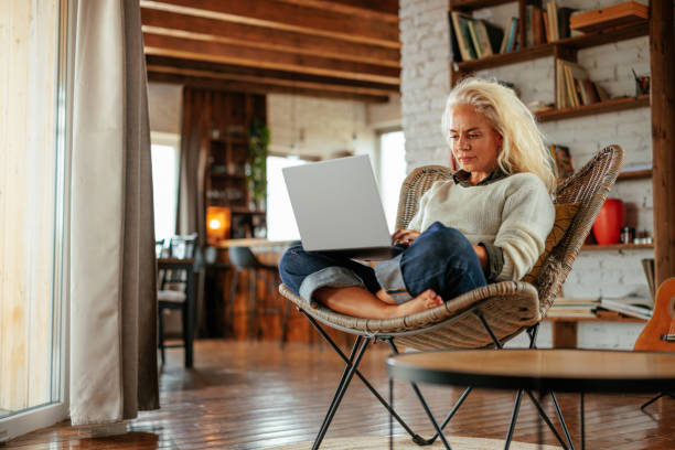 istock Concentrated man working on laptop at home 2159298161