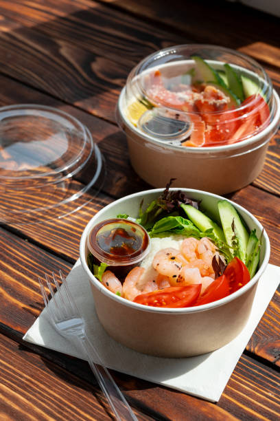 istock Take out poke bowl on wooden background 2159298371