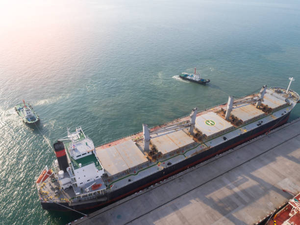 istock cargo ship, cargo container in warehouse harbor at thailand . 2159298456