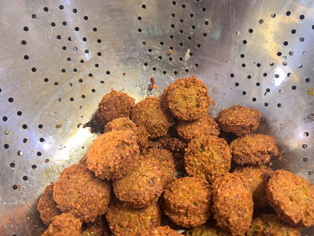 Falafel balls in a sieve