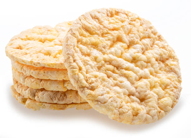Puffed corn cakes or rice cakes isolated on white. Alternative snack for bread product