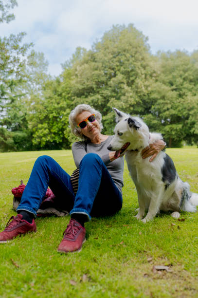 istock Older woman with her dog 2159303619