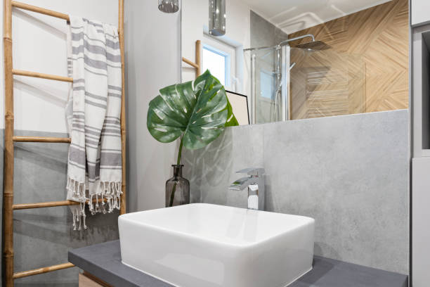 istock Home interior of modern bathroom with ceramic bathroom sink and herringbone tile bon the wall and mirror. Elegance and luxury in new apartment. 2159306324