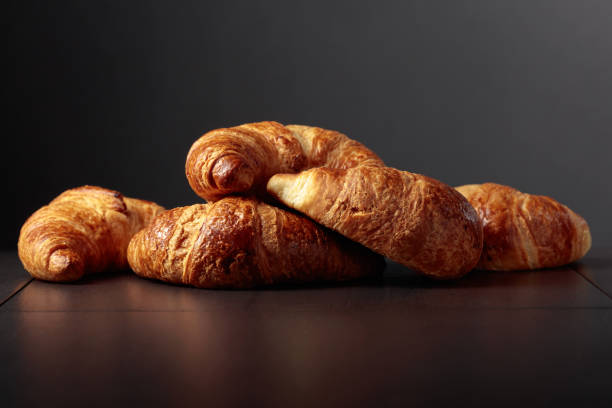 istock Freshly baked croissants on a black ceramic table. 2159307907