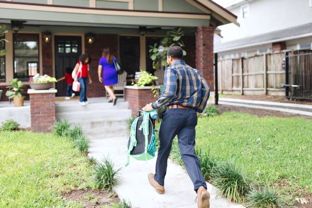 istock Father running to the house after work 2159309787
