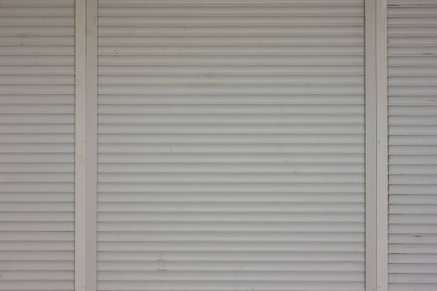 Metal roller shutter door of white color