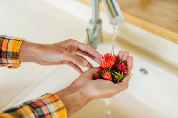 istock Washing strawberries in the kitchen 2159310561