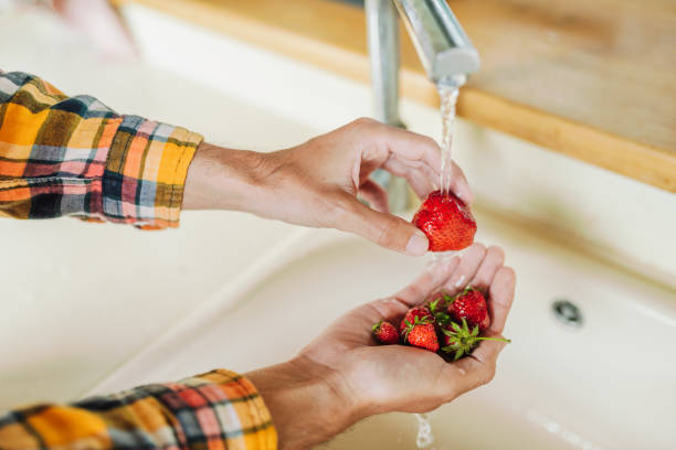 istock Washing strawberries in the kitchen 2159310564