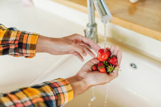 istock Washing strawberries in the kitchen 2159310565
