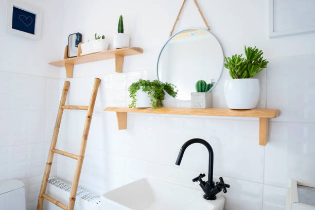 istock Home interior with ceramic bathroom sink and bowl and white tile on the wall with circle mirror. Rustic bathroom in indoors architecture and cosy design. 2159310637