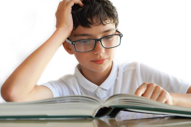 istock preadolescent child with intellectual giftedness reading 2159310906