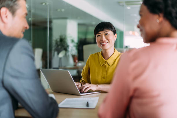 istock Group of business persons talking in the office. 2159311907