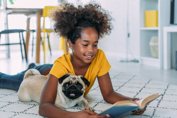 istock Girl and a dog at home. 2159312837