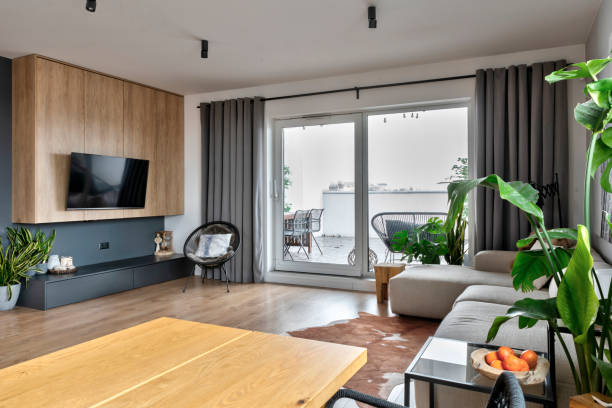istock Home decor. Modern interior with dining table and chair and sofa with television in living room with window. 2159312875