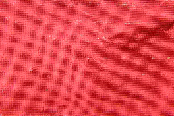 red paper texture close up. bright red background