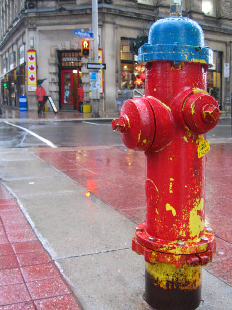 Ancient red fire hydrant, faucet or fire hydrant, a water intake to provide a flow rate in the event of a fire. Ottawa, Canada.
