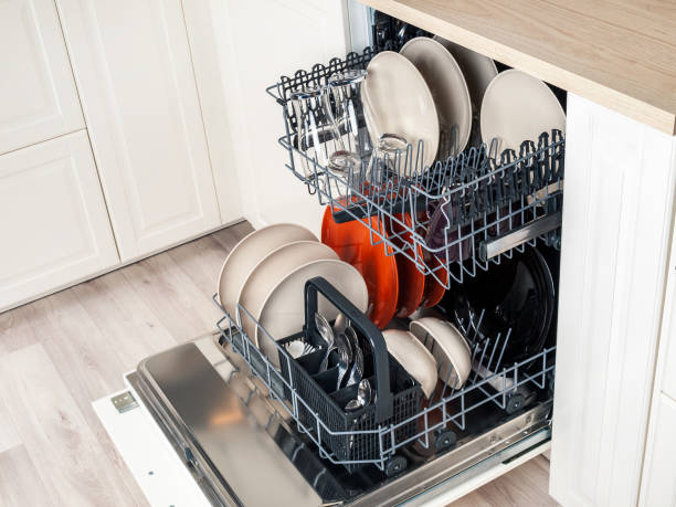 istock Modern dishwasher built into the kitchen unit for washing dishes 2159314757