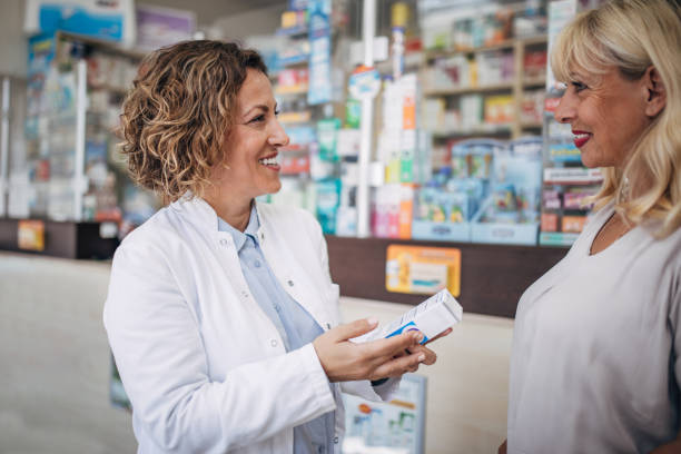 istock Pharmacist and senior customer talking in the pharmacy 2159315360