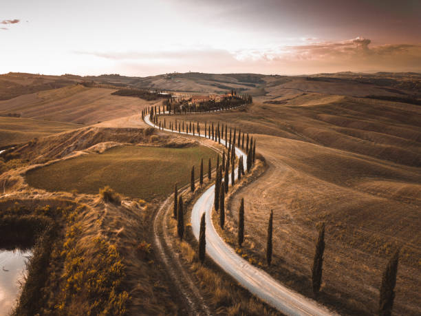 istock winding road in tuscany at crete senesi 2159315362