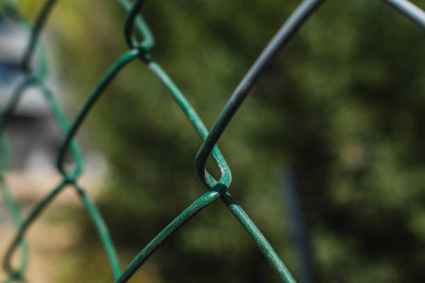 wire fence of mesh close-up with blurred background