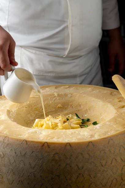 istock Fresh pasta with sauce in a whole parmesan wheel 2159317856