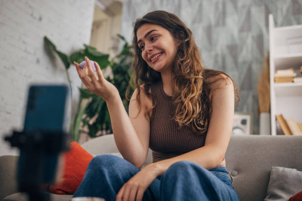 istock Smiling woman presenting beauty product 2159317977