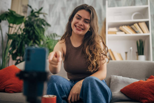 istock Happy woman interacting with smartphone camera 2159318114