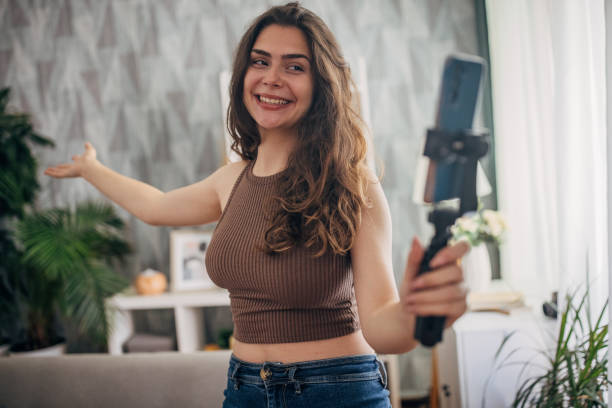 istock Woman gesturing while vlogging at home 2159318835
