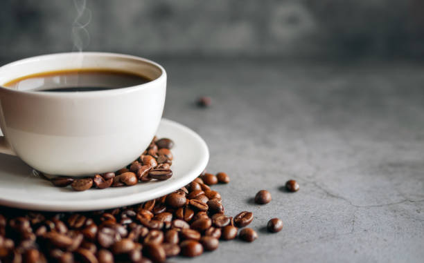 istock Coffee cup and coffee beans on  gray background, Black coffee cup aromatic,Close up 2159320688