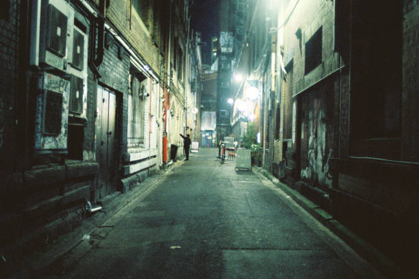 This picture illustrates how the design and structure of contemporary urban spaces can contribute to a sense of isolation and disconnection among individuals. The narrow, dimly lit alleyway, devoid of bustling activity, symbolizes the decline of vibrant public spaces where people can engage in meaningful social and political interactions. The solitary figure in the distance emphasizes the diminished sense of community and public life, highlighting the urban environment's impact on social dynamics. This photo was taken with a 35 mm negative film on a film camera, which made the colors come out vividly.