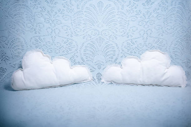 children's background with pillows in the form of a cloud on a blue background