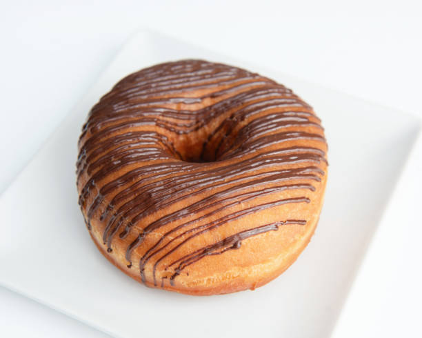 istock Chocolate Doughnuts Isolated, Brown Donuts with White Stripes, Cocoa Doughnuts on White Background 2159323175