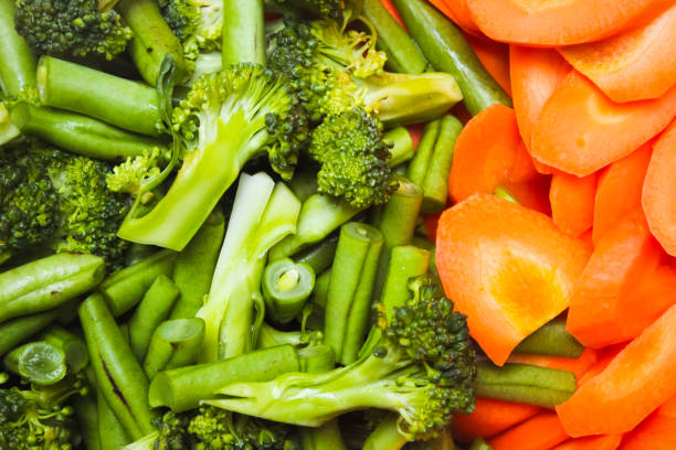 istock close up of raw vegetables cut into pieces, as background 2159323684