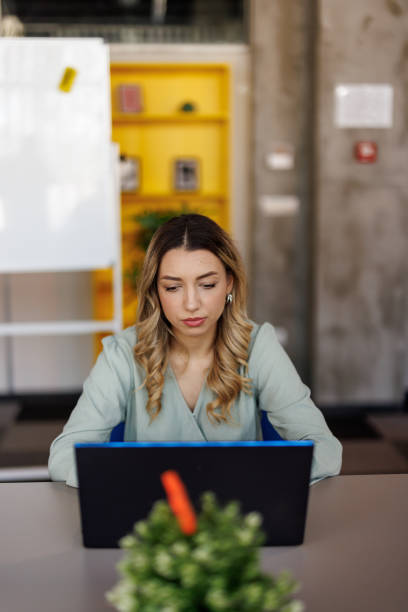 istock Concentrated businesswoman at work place 2159325525