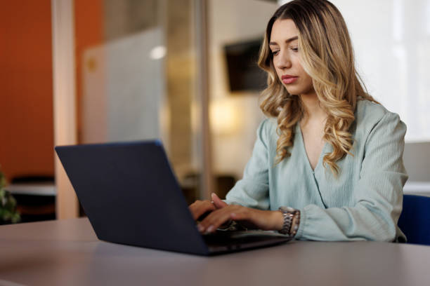 istock Concentrated businesswoman at work place 2159326258