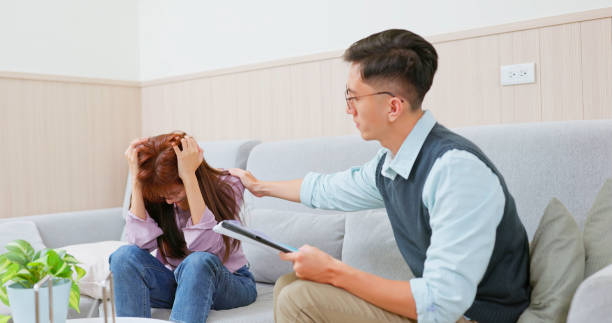istock asian lady counseling and crying 2159327991