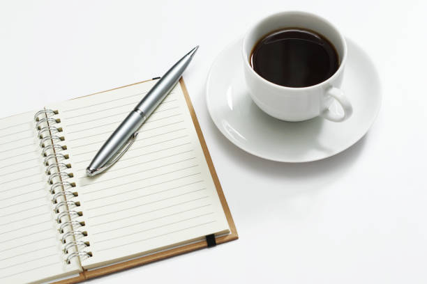 istock Notebook, pen and cup of coffee 2159328357