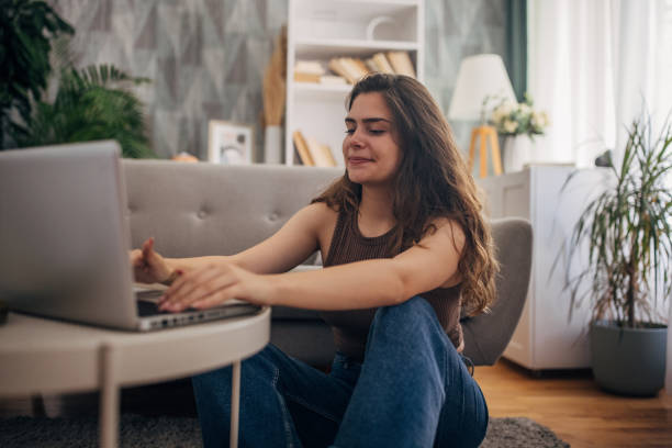 istock Casual woman with laptop smiling 2159328388