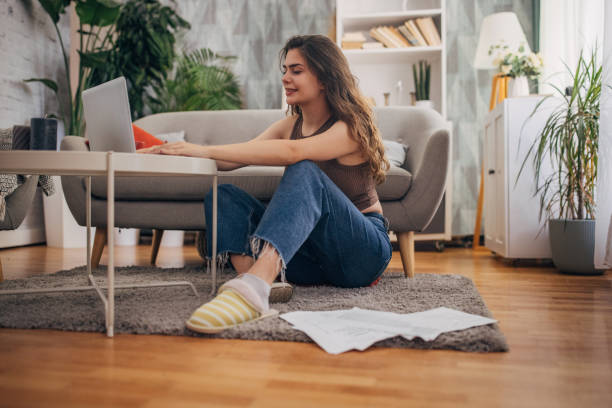 istock Woman working with laptop and papers 2159328767