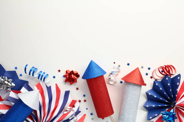 istock Flat lay firework rockets, paper fans, party decorations on white background. USA Independence Day 4th of July banner design. 2159329880
