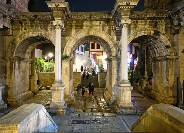 Antalya, Turkey -22 April, 2024. Hadrian's Roman Gate is a memorial gate located in Antalya old town in Kaleici district, on night time Turkey,