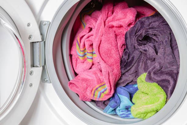 istock Colored towels in the washing machine 2159335210