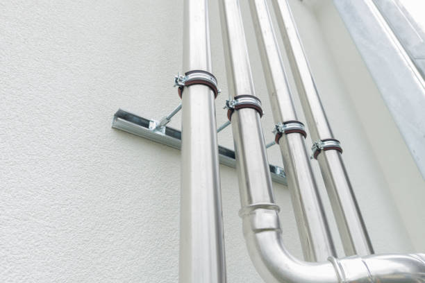 Large Stainless Steel HVAC Pipes on Wall