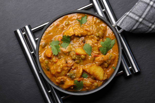 istock Spicy Hot Chicken Curry with Pita Bread 2159336345