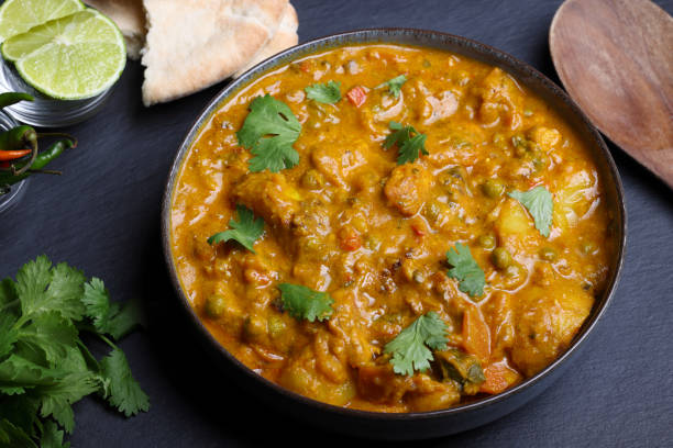 istock Spicy Hot Chicken Curry with Pita Bread 2159336347