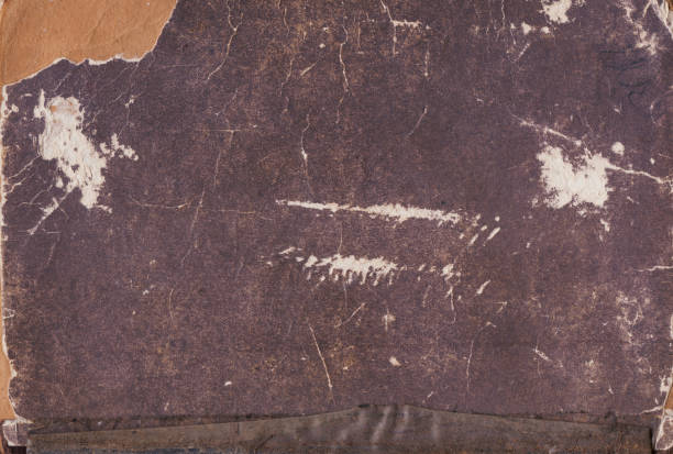 istock Vintage background of old book paper texture with scratches 2159336364