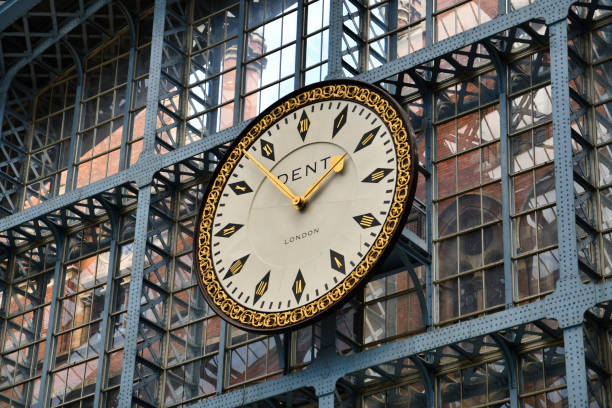 The St. Pancras Station clock in London is a striking Victorian-era timepiece adorning the iconic station's facade. This historic clock, a symbol of punctuality and architectural grandeur, overlooks the Eurostar terminal, blending 19th-century charm with modern transit.